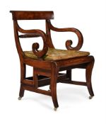 A GEORGE IV SIMULATED ROSEWOOD METAMORPHIC LIBRARY CHAIR, IN THE MANNER OF MORGAN & SAUNDERS