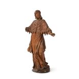 A CARVED LIMEWOOD FIGURE OF A STANDING APOSTOLIC FIGURE SWISS OR SOUTH GERMAN, 17TH CENTURY