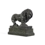 A GREEN SERPENTINE MARBLE FIGURE OF A PROWLING LION PROBABLY ITALIAN, EARLY 20TH CENTURY