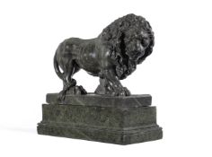 A GREEN SERPENTINE MARBLE FIGURE OF A PROWLING LION PROBABLY ITALIAN, EARLY 20TH CENTURY