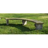 A CARVED PORTLAND STONE CURVED GARDEN SEAT, 19TH CENTURY, of Exedra form
