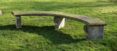 A CARVED PORTLAND STONE CURVED GARDEN SEAT, 19TH CENTURY, of Exedra form