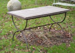 A STONE TOPPED IRON BASE GARDEN TABLE, EARLY 20TH CENTURY