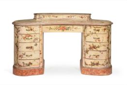 A CONTINENTAL CREAM PAINTED AND POLYCHROME DECORATED KIDNEY-SHAPED DRESSING TABLE, POSSIBLY VENETIAN