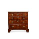 A GEORGE II WALNUT AND FEATHERBANDED CHEST OF DRAWERS, SECOND QUARTER 18TH CENTURY