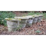 A SET OF FIVE STONE COMPOSITION GARDEN POTS, MODERN