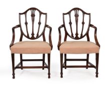 A PAIR OF GEORGE III MAHOGANY OPEN ARMCHAIRS, IN THE MANNER OF GEORGE HEPPLEWHITE