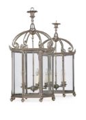 A LARGE PAIR OF METAL FRAMED HALL LANTERNS, 20TH CENTURY IN THE REGENCY MANNER