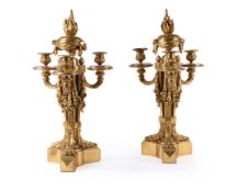 † A PAIR OF GILT BRONZE THREE-LIGHT CANDELABRA, IN LOUIS XVI STYLE, LATE 19TH CENTURY