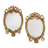 A PAIR OF VICTORIAN GILTWOOD AND COMPOSITION OVAL WALL MIRRORS, SECOND HALF 19TH CENTURY