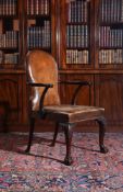 A GEORGE II MAHOGANY AND LEATHER LIBRARY ARMCHAIR, MID-18TH CENTURY