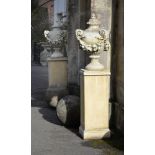 A PAIR OF RECONSTITUTED URNS ON STAND, CONTEMPORARY