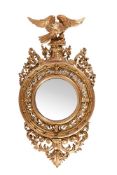 A LARGE REGENCY CARVED GILTWOOD CONVEX WALL MIRROR, CIRCA 1820