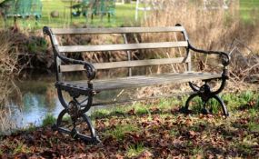 A VICTORIAN CAST IRON GARDEN SEAT, IN THE COALBROOKDALE 'ELIZABETHAN' PATTERN