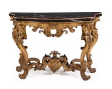 A CONTINENTAL CARVED GILTWOOD SERPENTINE CONSOLE TABLE PROBABLY ITALIAN