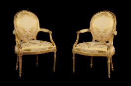 A PAIR OF GEORGE III GILTWOOD AND YELLOW DAMASK UPHOLSTERED OPEN ARMCHAIRS, CIRCA 1780