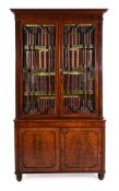 Y A GEORGE IV MAHOGANY BOOKCASE CABINET, IN THE MANNER OF GILLOWS, CIRCA 1825
