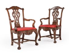 ANOTHER PAIR OF CARVED WALNUT OPEN ARMCHAIRS, PROBABLY PORTUGUESE, LATE 18TH CENTURY