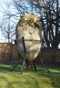 A MONUMENTAL TERRACOTTA VASE OR 'PITHOS' ON IRON STAND, THE VASE PROBABLY 19TH CENTURY