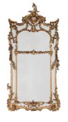 A LARGE CARVED GILTWOOD WALL MIRROR, IN GEORGE III STYLE, 19TH CENTURY