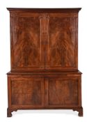 A GEORGE III MAHOGANY BOOKCASE CABINET, IN THE MANNER OF THOMAS CHIPPENDALE, CIRCA 1770