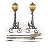 A LARGE PAIR OF WROUGHT IRON AND BRASS ANDIRONS, POSSIBLY DESIGNED BY J.H. POLLEN AND BY JOSHUA HART