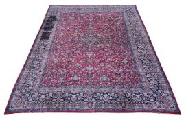 A LARGE TABRIZ CARPET, bearing signature to one end, approximately 490 x 349cm