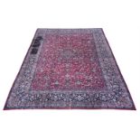 A LARGE TABRIZ CARPET, bearing signature to one end, approximately 490 x 349cm