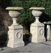 A LARGE PAIR OF COTSWOLD STONE VASES ON PEDESTALS, VASES CIRCA 1810-1830