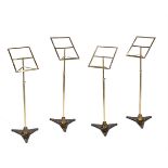 A SET OF FOUR BRASS AND CAST IRON MUSIC STANDS, IN THE STYLE OF SEBASTIAN ERAD, EARLY 20TH CENTURY