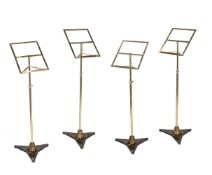 A SET OF FOUR BRASS AND CAST IRON MUSIC STANDS, IN THE STYLE OF SEBASTIAN ERAD, EARLY 20TH CENTURY