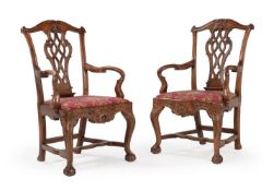 A PAIR OF CARVED WALNUT OPEN ARMCHAIRS, PROBABLY PORTUGUESE, LATE 18TH CENTURY