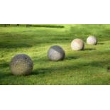 ANOTHER SET OF FOUR CORNISH GRANITE BALLS, 20TH CENTURY