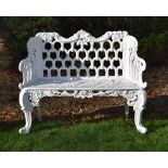 A SMALL CAST IRON GARDEN BENCH AFTER THE CARRON FOUNDRY DESIGN, 20TH CENTURY