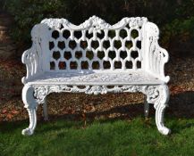 A SMALL CAST IRON GARDEN BENCH AFTER THE CARRON FOUNDRY DESIGN, 20TH CENTURY