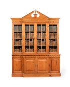 A PINE BREAKFRONT BOOKCASE, IN GEORGE II STYLE, 20TH CENTURY