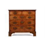 A GEORGE II WALNUT AND FEATHERBANDED CHEST OF DRAWERS, CIRCA 1740