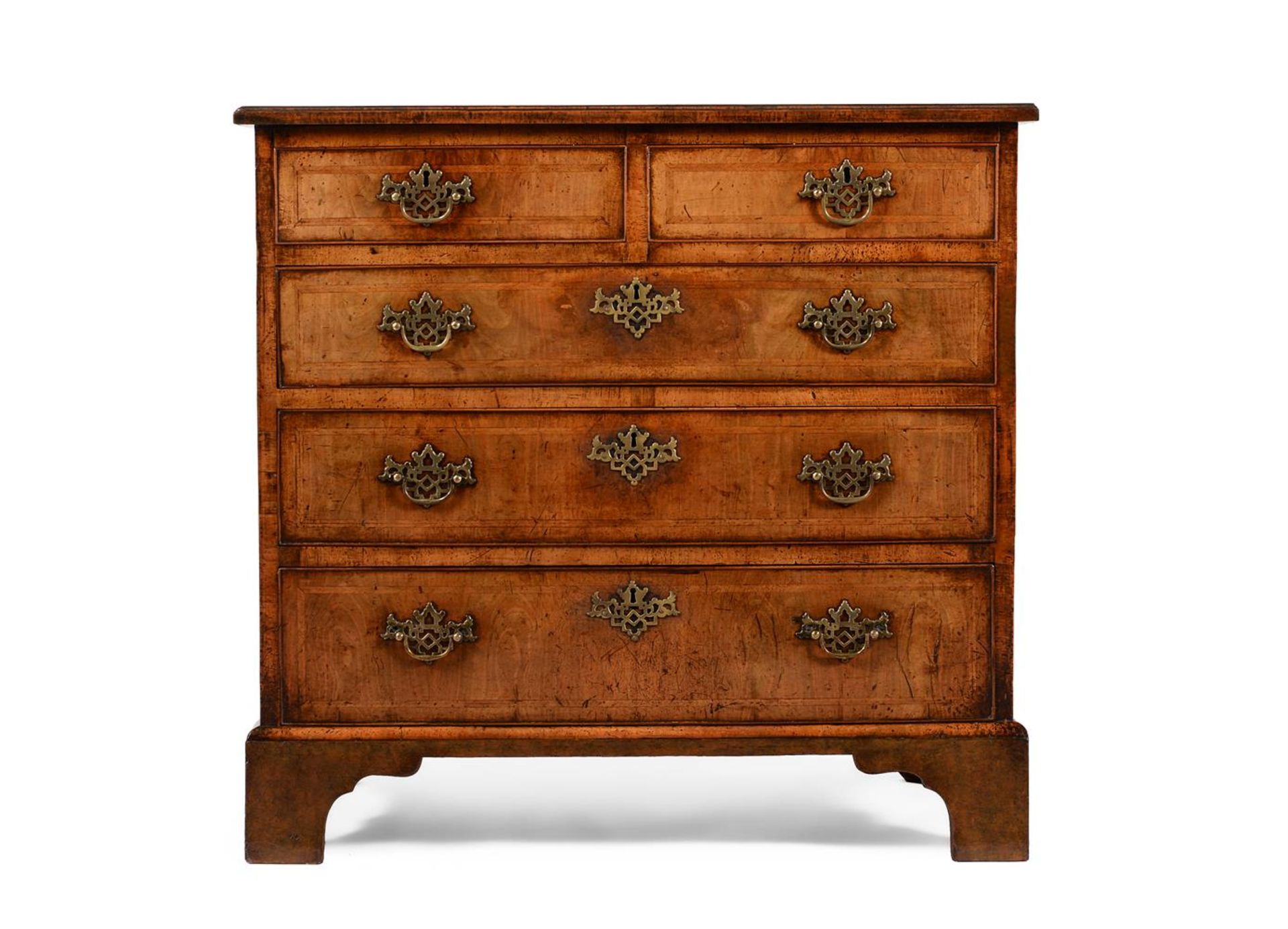 A GEORGE II WALNUT AND FEATHERBANDED CHEST OF DRAWERS, CIRCA 1740