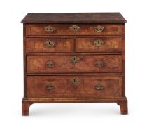 A GEORGE I BURR AND FIGURED WALNUT CHEST OF DRAWERS, OF SMALL SIZE, CIRCA 1720