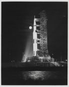 Saturn rocket stands ready with the Moon shining next to it, Apollo 17, 7-19 Dec 1972