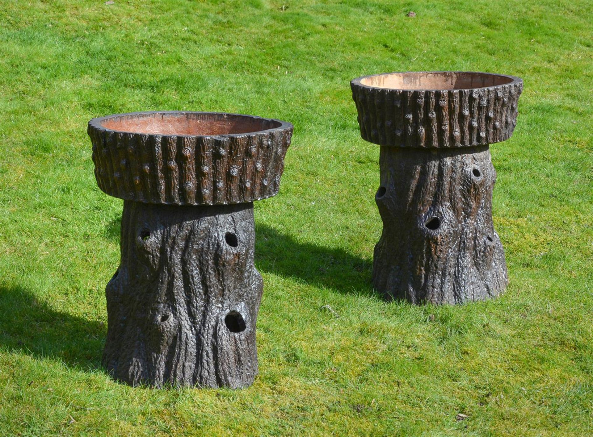 A PAIR OF VICTORIAN TREACLE GLAZED STRAWBERRY PLANTERS