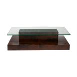 A GLASS TOPPED AND BROWN VELUM PARCHMENT CLAD COFFEE TABLE
