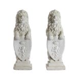 A PAIR OF WHITE PAINTED COMPOSITE STONE MODELS OF HERALDIC LIONS