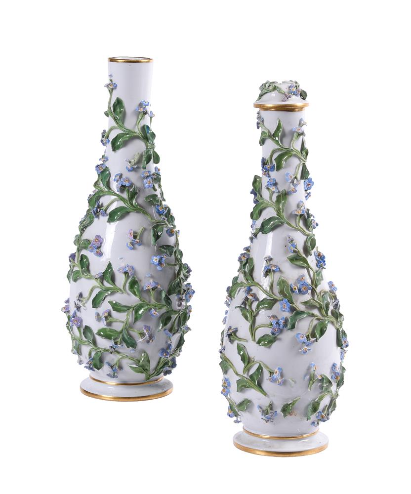 A PAIR OF MEISSEN FLOWER-ENCRUSTED SLENDER BOTTLE VASES AND A COVER