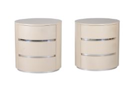 A PAIR OF CREAM LAMINATE BEDSIDE TABLES