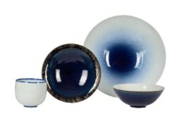 λ IVAR MACKAY (b.1950)A GROUP OF FOUR COBALT-BLUE AND COBALT-BLUE ON CELADON GROUND GLAZED BOWLSVari