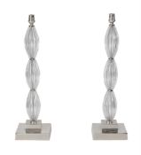A PAIR OF MOULDED GLASS AND CHROME TABLE LAMPS