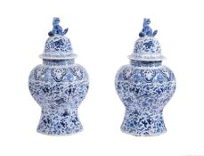 A PAIR OF DUTCH DELFT BLUE AND WHITE BALUSTER VASES AND COVERS