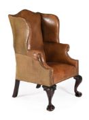 A MAHOGANY AND BROWN LEATHER UPHOLSTERED ARMCHAIR IN GEORGE II STYLE