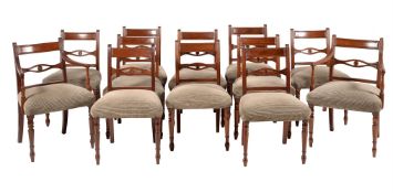 A SET OF TWELVE MAHOGANY DINING CHAIRS